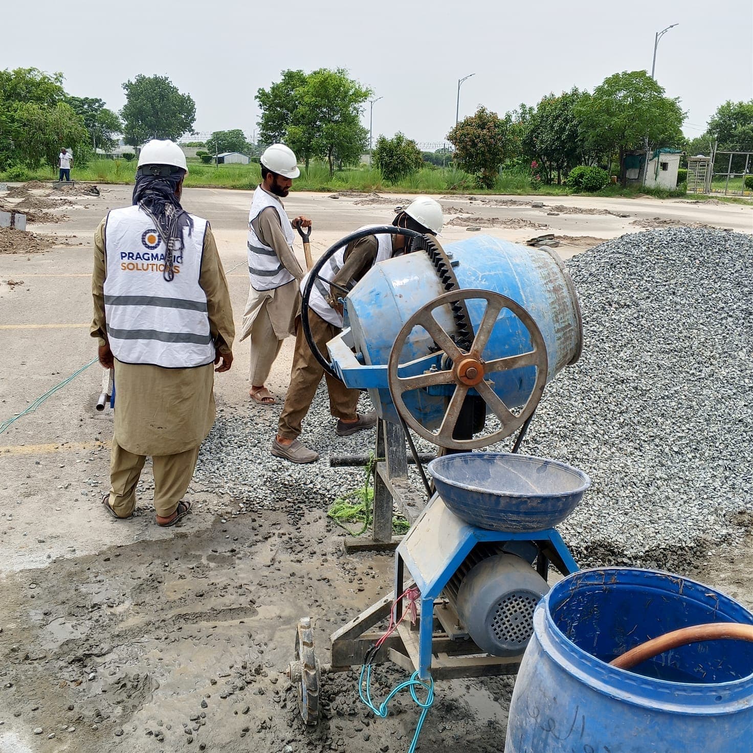 Kartarpur Peace Corridor team near concrete mixer